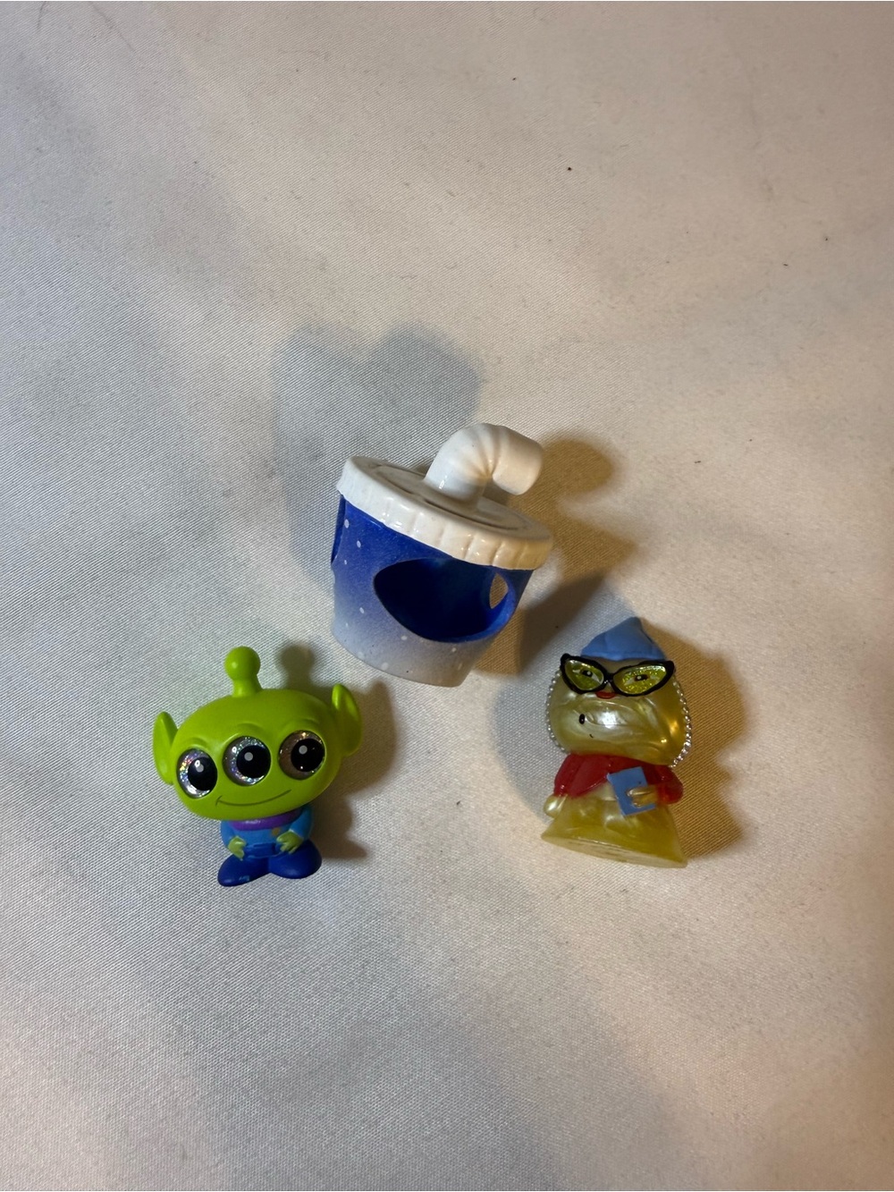 Disney Bright Green Three‑Eyed Alien Figure with Blue Drink and Yellow Accessory